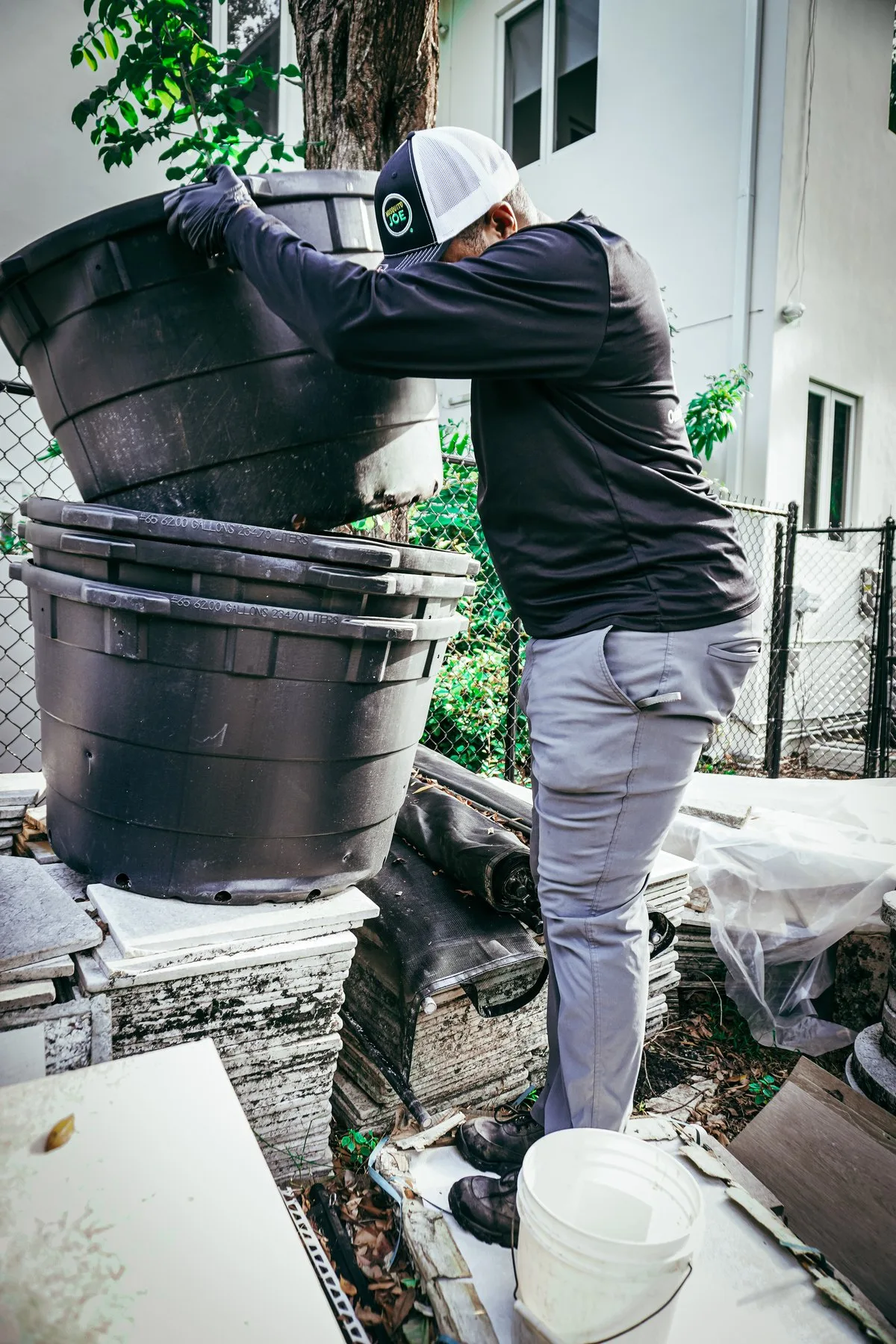 A technician checking water containers