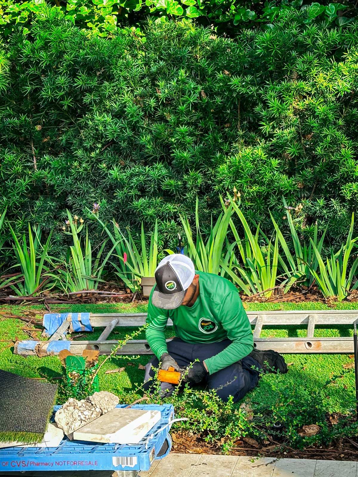 A technician installing equipment at ground level
